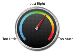 Colorful gauge with red needle on black background.