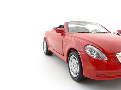 Minimalist gray line drawing of a hand holding a heart shape.